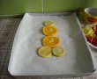 Pastrav la cuptor, pe pat de portocala, lamaie si limeta-8